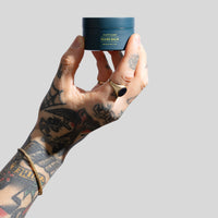 Ruffians Beard Balm in barber hand